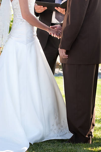 istock Wedding Ceremony Close Up with Bride and Groom Exchanging Vows 176055016