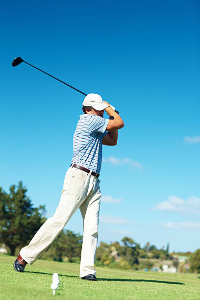 istock Mature golfer swinging golf club during practice 176055139