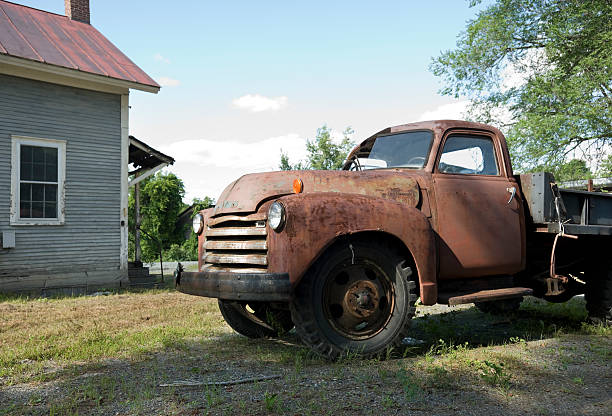istock Abandoned Red truck in front of building 176056223