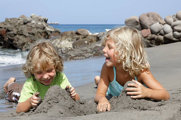 istock happy children on the beach 176056634