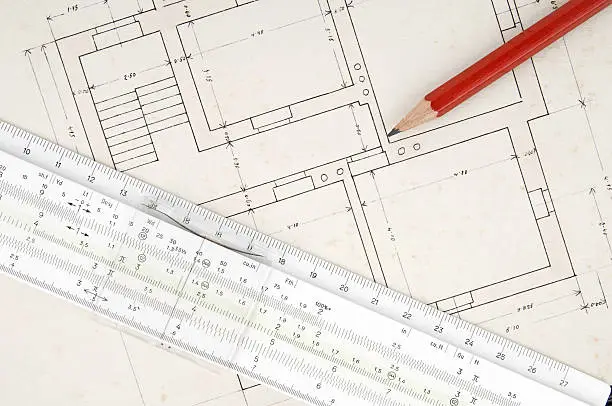 house plan with slide-rule and pencil