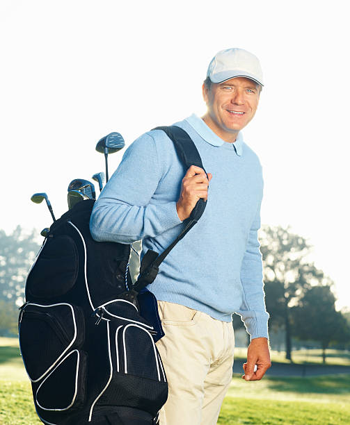 istock Handsome golfer with his golf kit bag 176057154