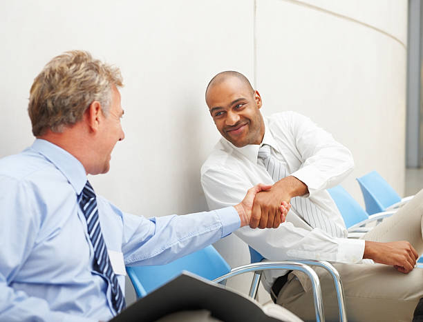 istock Business colleagues shaking hands in office 176057360