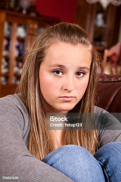 Moody Teenage Girl On Sofa Stock Photo - Download Image Now - 14-15 Years, Adolescence, Blond Hair