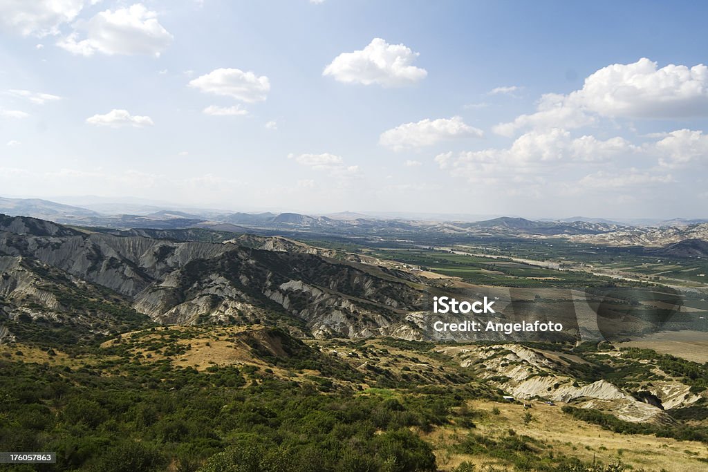 Landscape of Basilicata "Landscape of Basilicata taken from the Sancuary of Santa Maria di Anglona, near Tursi, Basilicata, Italy.The mountains in the picture are mainly made of clay, whose erosion produces the particular conformation." Basilicata Region Stock Photo