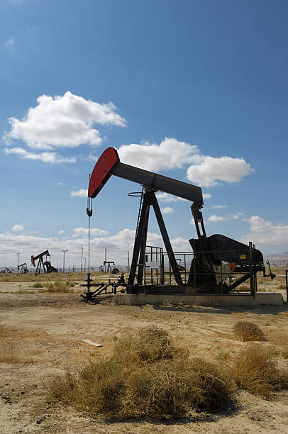 istock Oil Pumpjack with Tumbleweed in Foreground 176057948