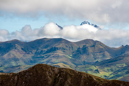 Ilinizas south peak with snow and agriculture fields, Andes mountains, Quito region, Ecuador.