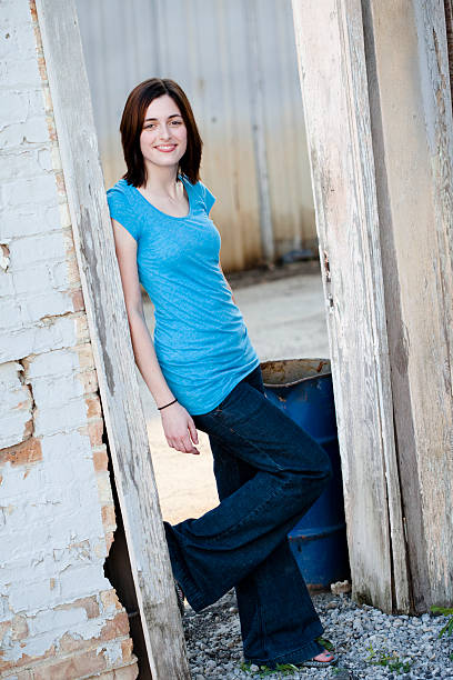 istock Girl Standing in Run Down Urban Area 176058381