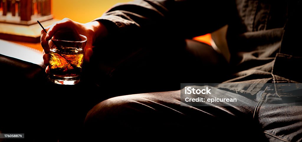Closeup Of A Man Drinking Alone Stock Photo - Download Image Now -  Cocktail, Cozy, Sofa - iStock