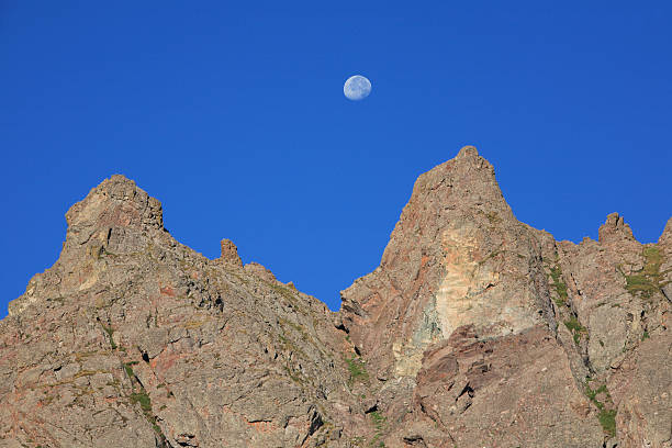 istock rock spires and daytime moon. 176059060