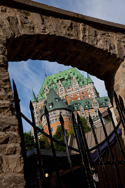 istock Chateau Frontenac framed by a stone wall and gate 176059930