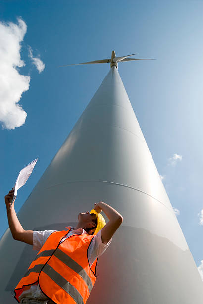 建設作業員に windfarm - engineer environment orange manual worker ストックフォトと画像