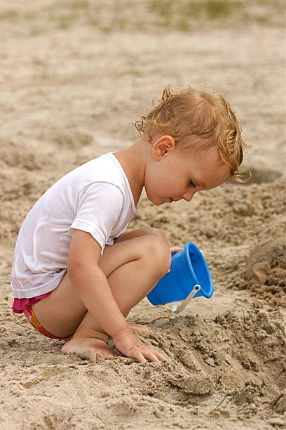 istock Small Child Playing at the Beach 176060063