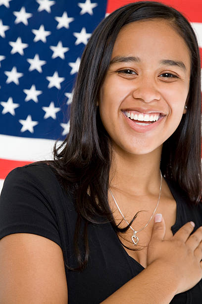 istock Smiling Young Patriotic Girl with Hand Over Her Heart 176060607