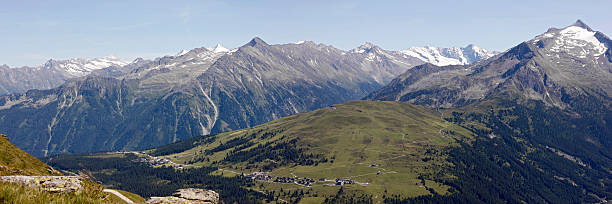 Zillertal alps panorama "View on the Zillertaler alps, Austria, with snowcapped mountains as seen from Koenigsleiten (near the Gerlos pass) at an altitude of 2300+ meters. Taken in the summer of 2009, stitch of 2 images.Canon 1Ds Mark III + 70 mm @ ISO 100, stitched and cropped + downsized" zillertaler alps stock pictures, royalty-free photos & images