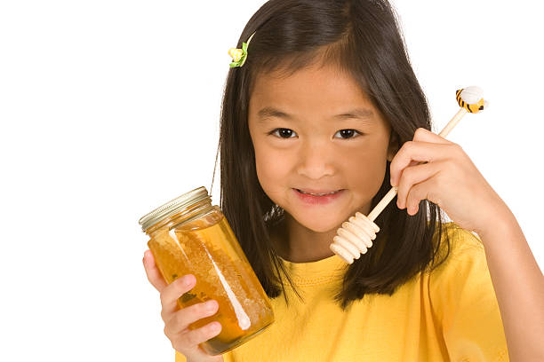 istock Little girl and honey series 176061265