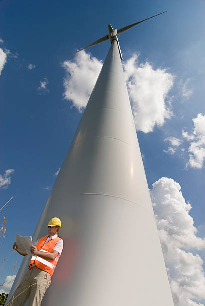建設作業員に windfarm - engineer environment orange manual worker ストックフォトと画像