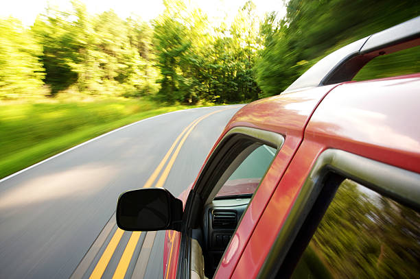 istock suv driving through country roads 176061665