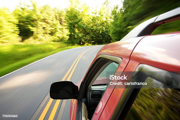 Suv Driving Through Country Roads Stock Photo - Download Image Now - Pick-up Truck, Red, Symmetry