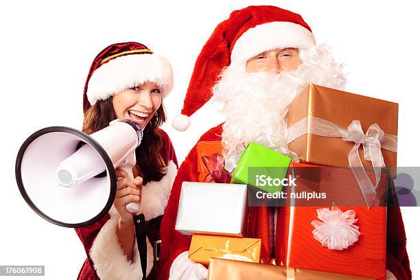 Mr And Mrs Santa Claus With A Pile Of Gifts Stock Photo - Download Image Now - Adult, Adults Only, Advertisement