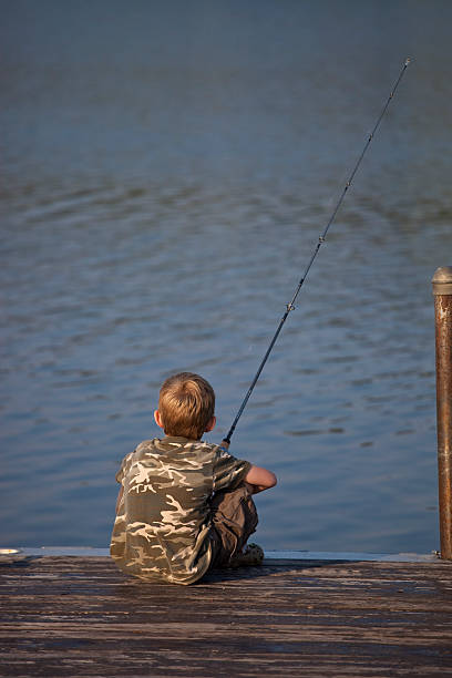istock Young boy fishing 176062509