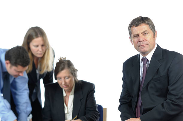 istock Business Man and his Team Working Behind Him 176062563