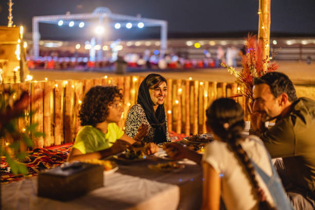 istock Tourists Experiencing Authentic Dinner In A Desert Camp In Dubai 1760630700