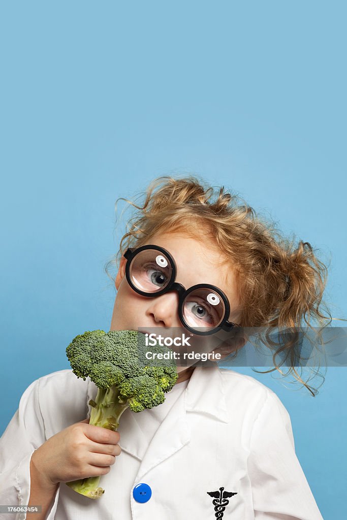 Child Doctor With Broccoli Eat Your Vegetables Stock Photo - Download Image  Now - Broccoli, Doctor, Biting - iStock