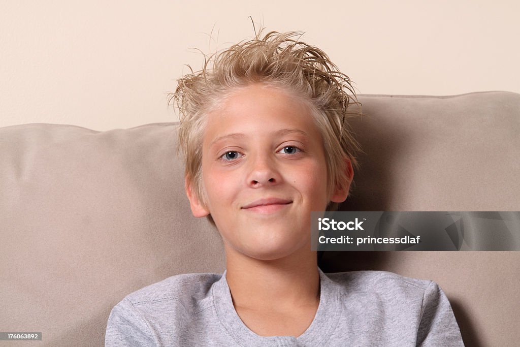 Teenage Boy Young teenage boy smiling at the camera Boys Stock Photo