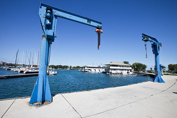 Boat Jib Cranes in Chicago Marina  jib stock pictures, royalty-free photos & images