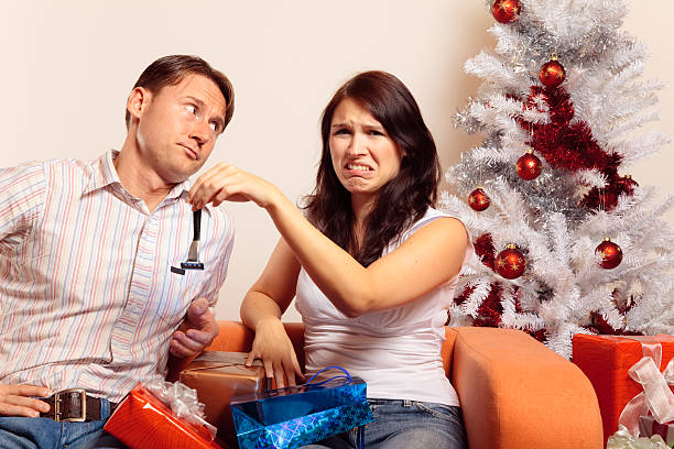 istock young couple exchanging christmas gifts (series) 176065605