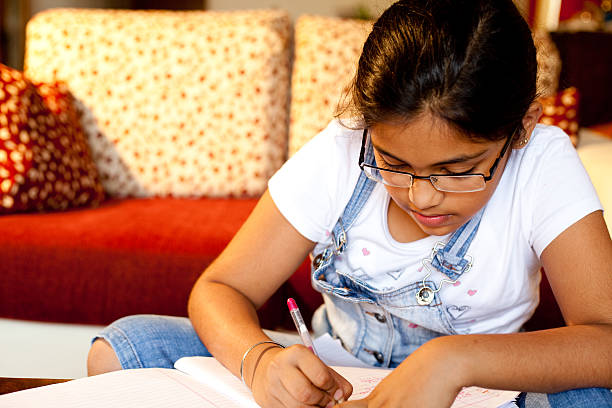 istock Completing homework Indian girl studying at home lifestyle shot Horizontal 176066604