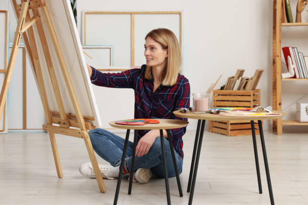 istock Beautiful woman painting in studio. Creative hobby 1760667883