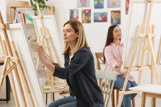 istock Women attending painting class in studio. Creative hobby 1760671953