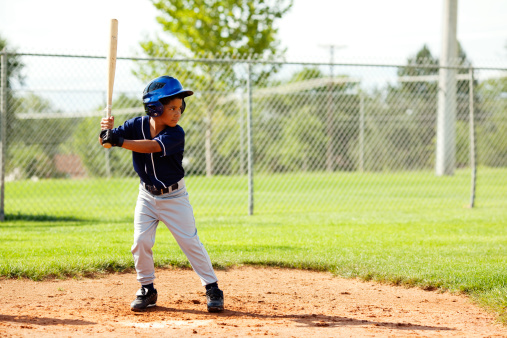 A youth league baseball player is up to the plate.