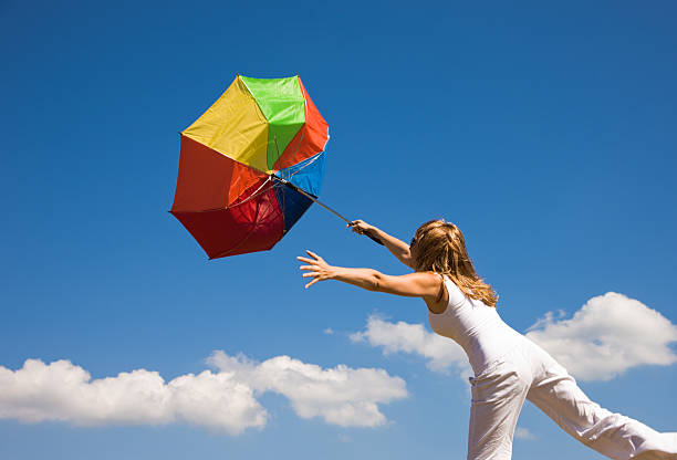 istock woman and a color umbrella 176068165