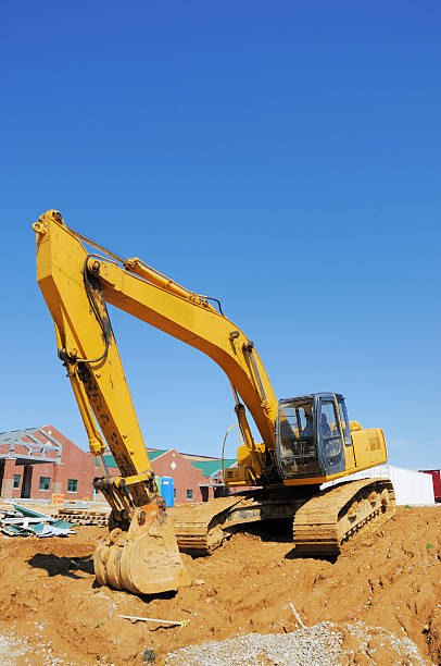 istock Backhoe Bucket and Earth Mover on Construction Site 176068172