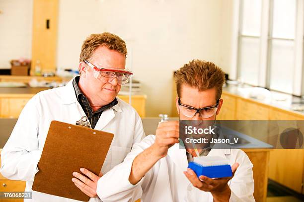 Teacher Watching Student Stock Photo - Download Image Now - Adult, Adults Only, Analyzing