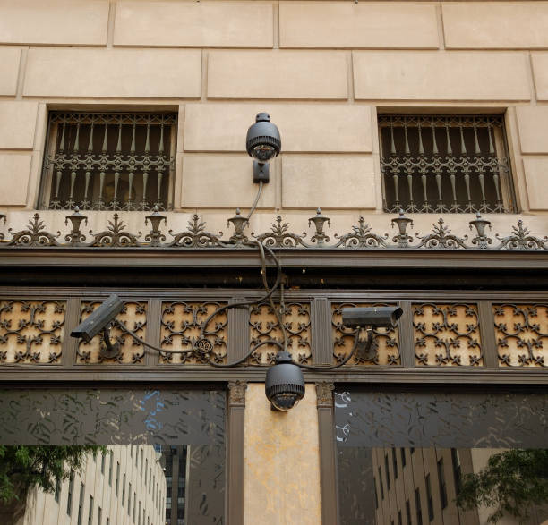istock Surveillance security cameras on NYC  retail store building 176069101