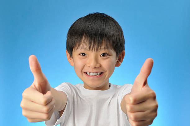 istock Boy's showing thumbs up sign 176069145