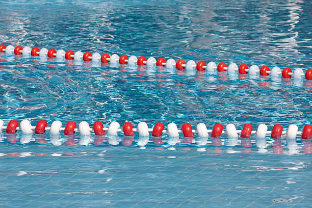 Swimming Lane Marker white and red lane marker in a swimming pool swimming pool lane ropes stock pictures, royalty-free photos & images