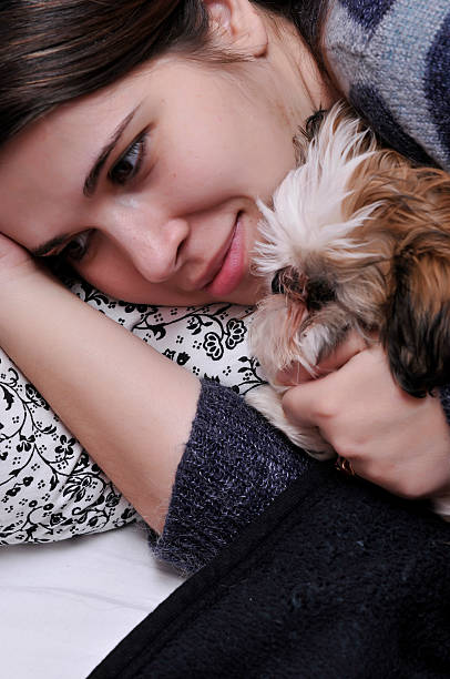 istock girl sitting with her dog 176069508