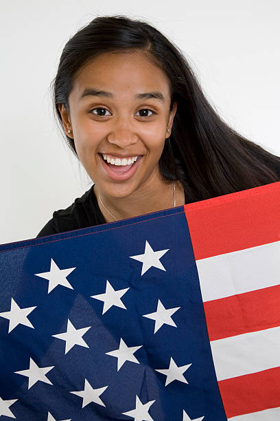 istock Surprised Young Hispanic Girl Holding an American Flag 176069593