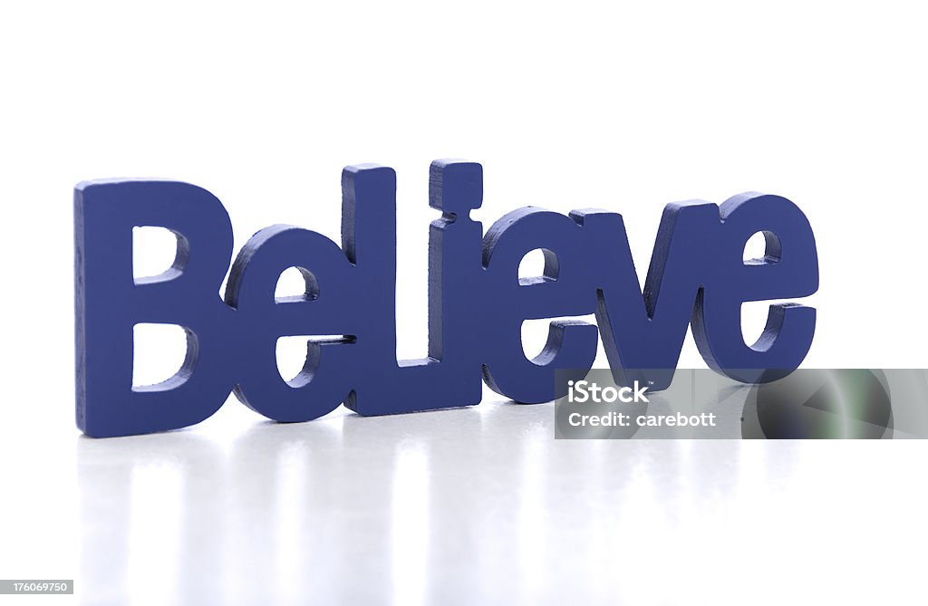 Believe A single word on a white background. Blue Stock Photo