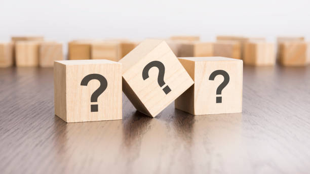 istock three wooden cubes with question marks over a grey background with copy space 1760698714