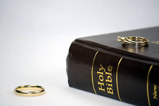 istock Wedding rings on Bible depict separation 176069913