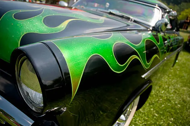 Deep metallic green paint on a classic American car from the early 1950's.