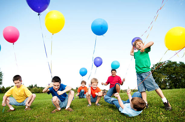 istock Group of Excited Boys Celebrating Outside 176070232