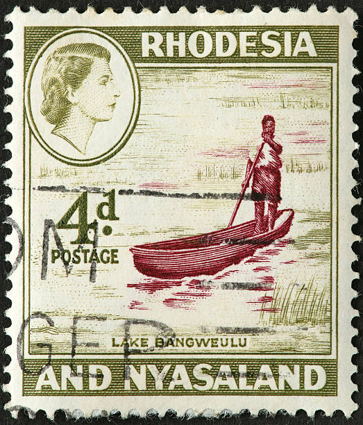 istock canoe and man on Lake Bangweulu 176070582