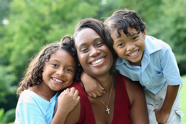 istock mother with two laughing kids 176070638